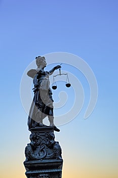 Silhouette of Lady Justice at the fountain at Romerberg in Frankfurt