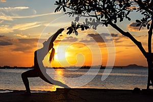 Silhouette lifestyle woman yoga exercise and worm up raise arm before pose for healthy life.