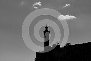 Silhouette of a lighthouse. Monochrome view of a lighthouse