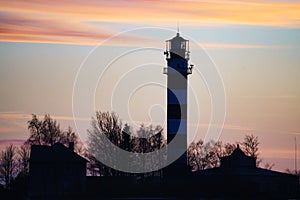 Silhouette Lighthouse with sunset in the background