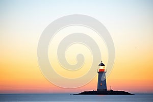 silhouette of a lighthouse at twilight