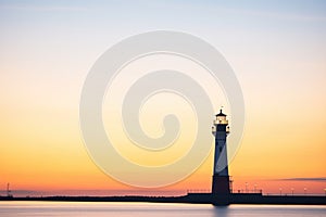 silhouette of a lighthouse at twilight