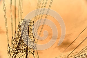 Silhouette line of high voltage electric pole with sunset background