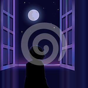 Silhouette of a little child is standing near the window and looking at the moon and starry sky.