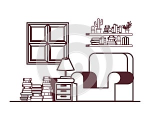 Silhouette of living room with couch and stack of books