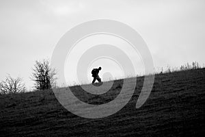 silhouette of a lone soldier on a tab march