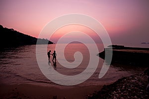 The silhouette of lover on the beach, sunset, twilight