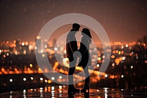 Silhouette of a loving couple on a background of the night city