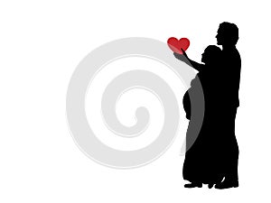 Silhouette loving husband gives heart beloved pregnant wife.