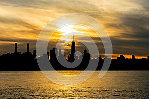 Silhouette of the Lower Manhattan Skyline on the East River in New York City during Sunset