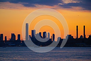 Silhouette of the Lower Manhattan Skyline on the East River in New York City during Sunset