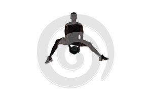 Silhouette of male athlete, basketball player in mid-air training, playing isolated on white background. Dynamics