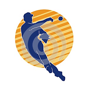 Silhouette of male baseball pitcher in action pose.