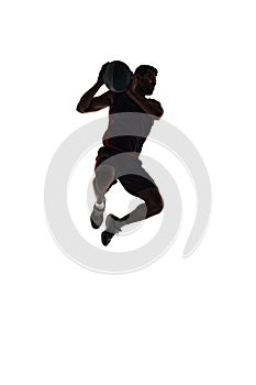 Silhouette of male basketball player in motion during game, training, playing isolated on white background. Full-length