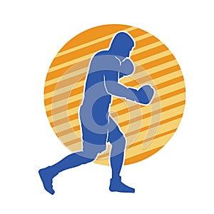 Silhouette of male boxing athlete in action pose.