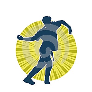 Silhouette of a male dancer in action pose.