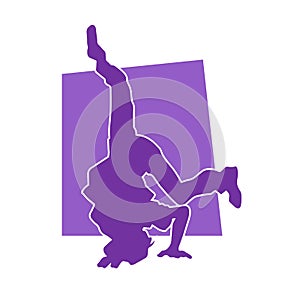 Silhouette of a male dancer doing hand stand pose.
