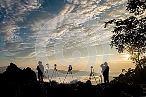 Silhouette of male photographer or traveler taking a photograph