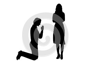 Silhouette of man beg on his knees in front of woman