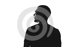 Silhouette of man from behind on a white background looks away