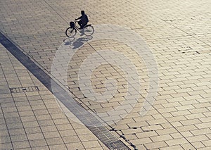 Silhouette man on bicycle outdoor Urban lifestyle Top view