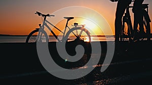 Silhouette of a Man on a Bicycle at Sunset Alone