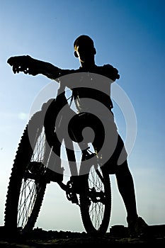 Silhouette of a man on the bike