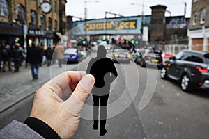 Silhouette of a man by Camden Town, in London, UK