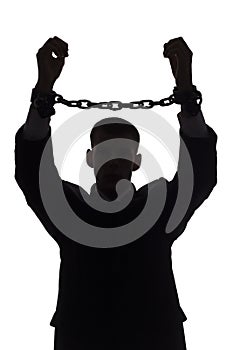 Silhouette of man with chains