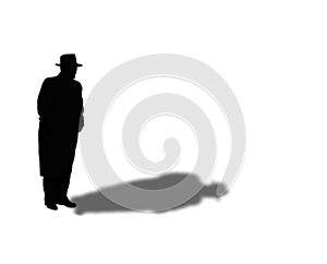 Silhouette and Shadow of Man in Fedora and Overcoat photo