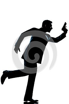 Silhouette man full length running holding gun