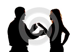 Silhouette man giving ring to woman