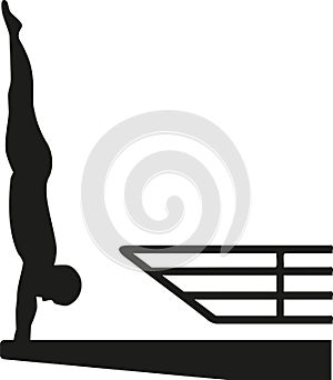 Silhouette of man at a high diving platform