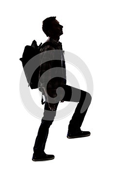 Silhouette of a Man or Hiker Mountain Climbing