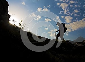 Silhouette of a man hiking