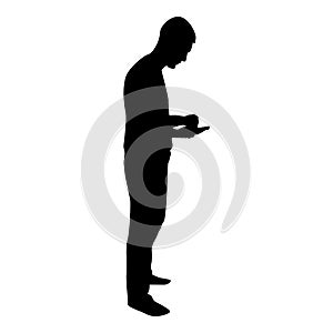 Silhouette man holding smartphone phone playing tablet male using communication tool idea looking phone addiction concept