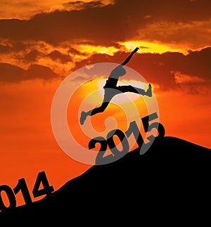 Silhouette man jumping over 2015