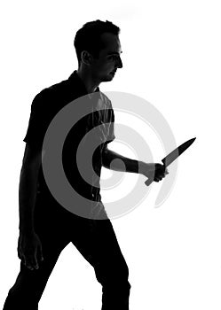 Silhouette of a man with knife