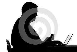 Silhouette of a man paying for purchases online