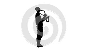 Silhouette of a man playing the saxophone standing sideways