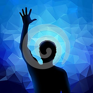 Silhouette of man with raised hand
