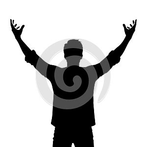 Silhouette of a man raising arms