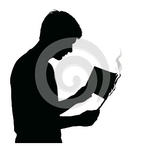 Silhouette of man reading burning book concept for censorship knowledge photo