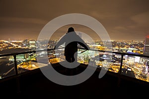 Silhouette of man on roof top