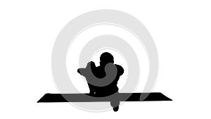 Silhouette Man in Seated Marichyasana yoga pose stretching leg and spine exercise.