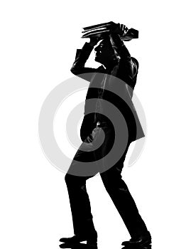 Silhouette man shielding with his briefcase