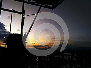 the silhouette of a man sitting relaxed