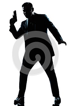 Silhouette man spy holding gun