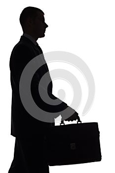 Silhouette of man with suitcase