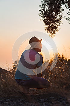 Silhouette of man in the summer field photo